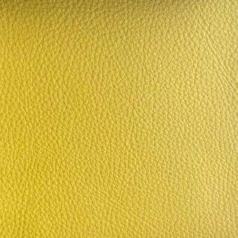 Yellow Rugiano leather texture with a smooth, fine-grained surface and consistent repeating indentations; S5009 finish for indoor applications.